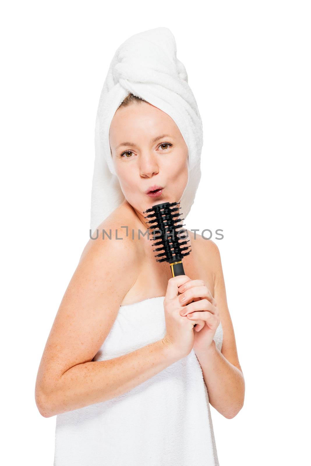 singer after the shower singing into a hairbrush on a white background