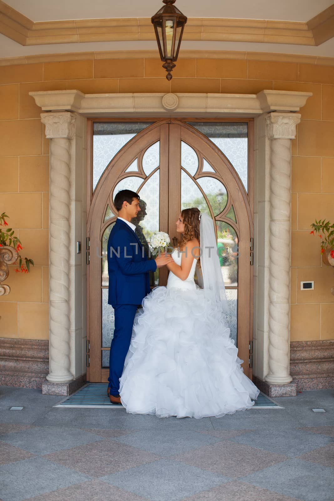 Newlyweds on a walk in the park on a warm sunny day