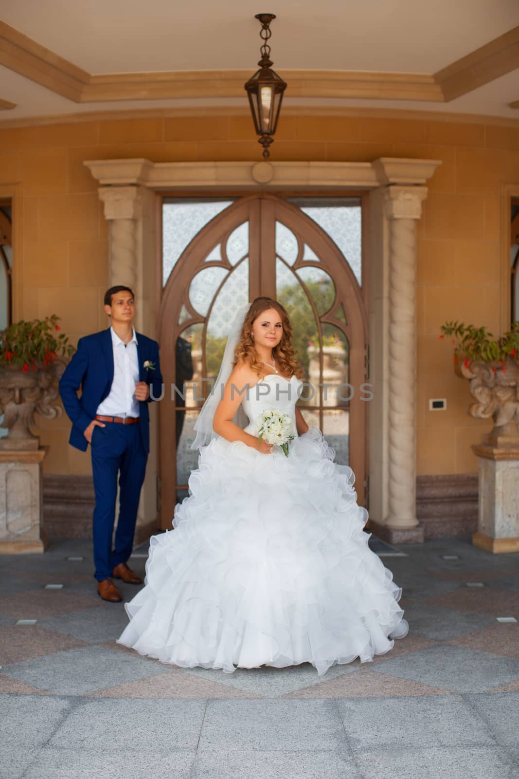 Newlyweds on a walk in the park on a warm sunny day