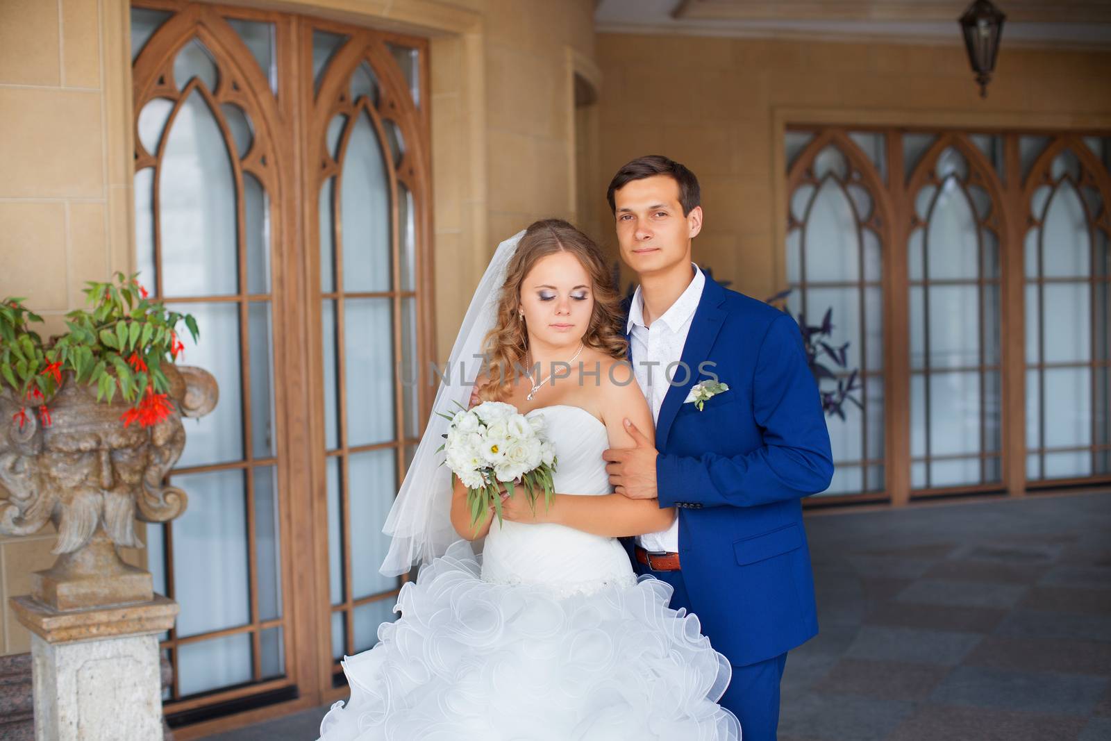 Newlyweds on a walk in the park on a warm sunny day