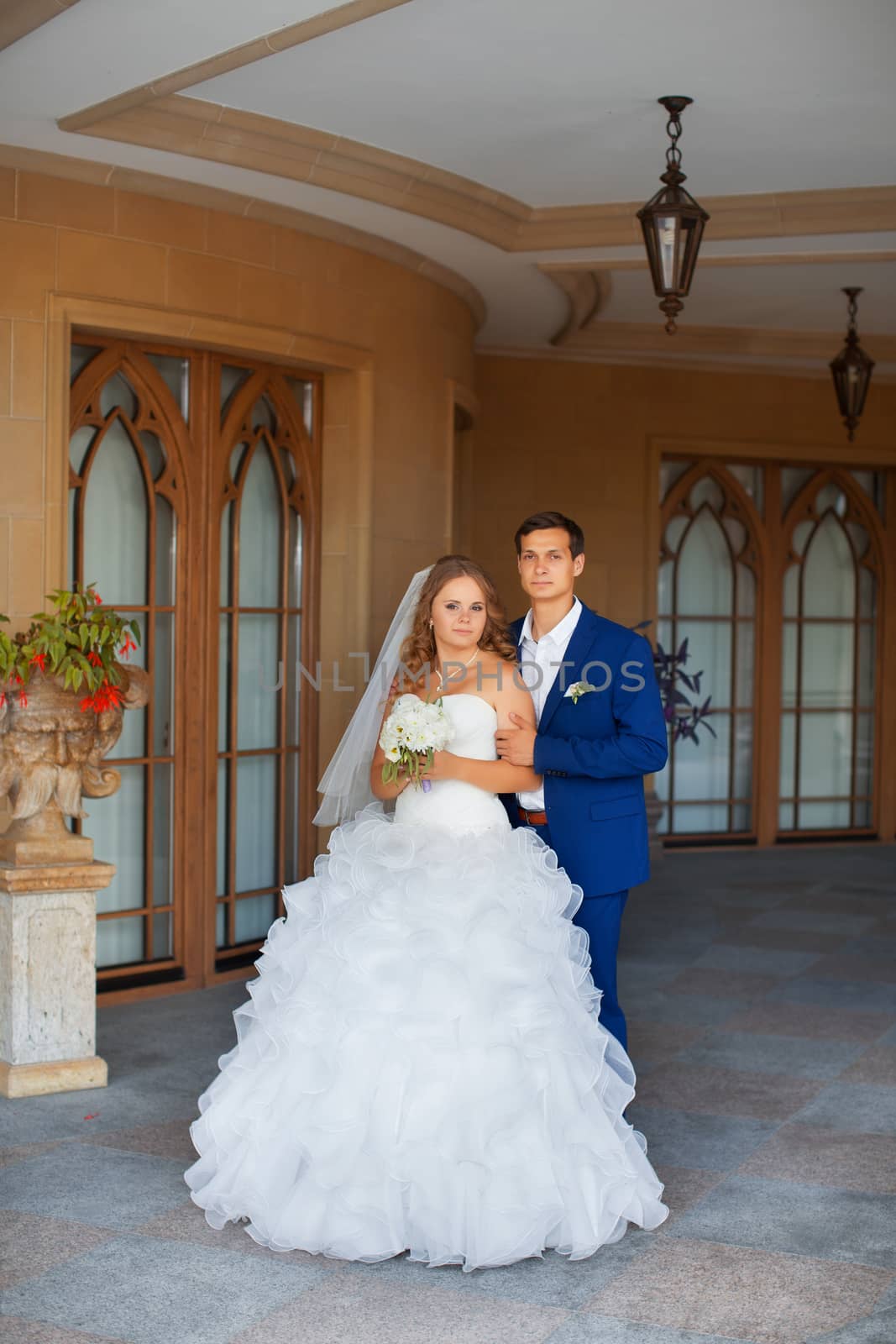 Newlyweds on a walk in the park on a warm sunny day