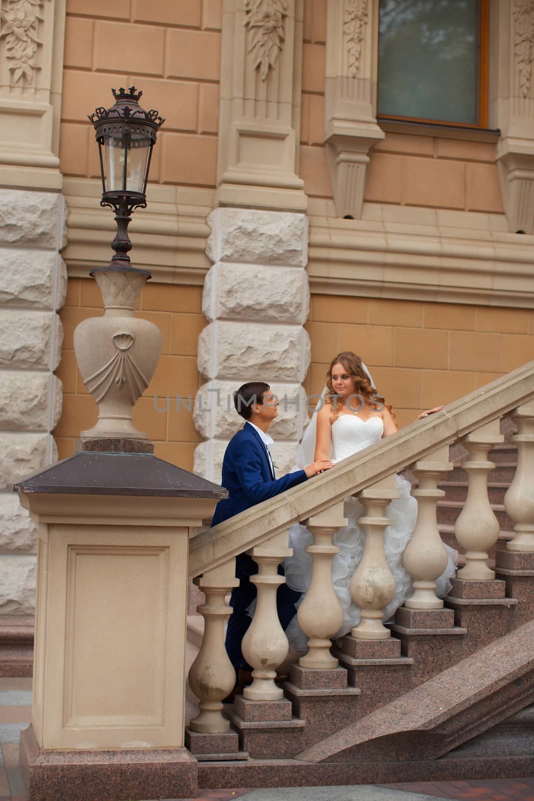 Newlyweds on a walk in the park on a warm sunny day