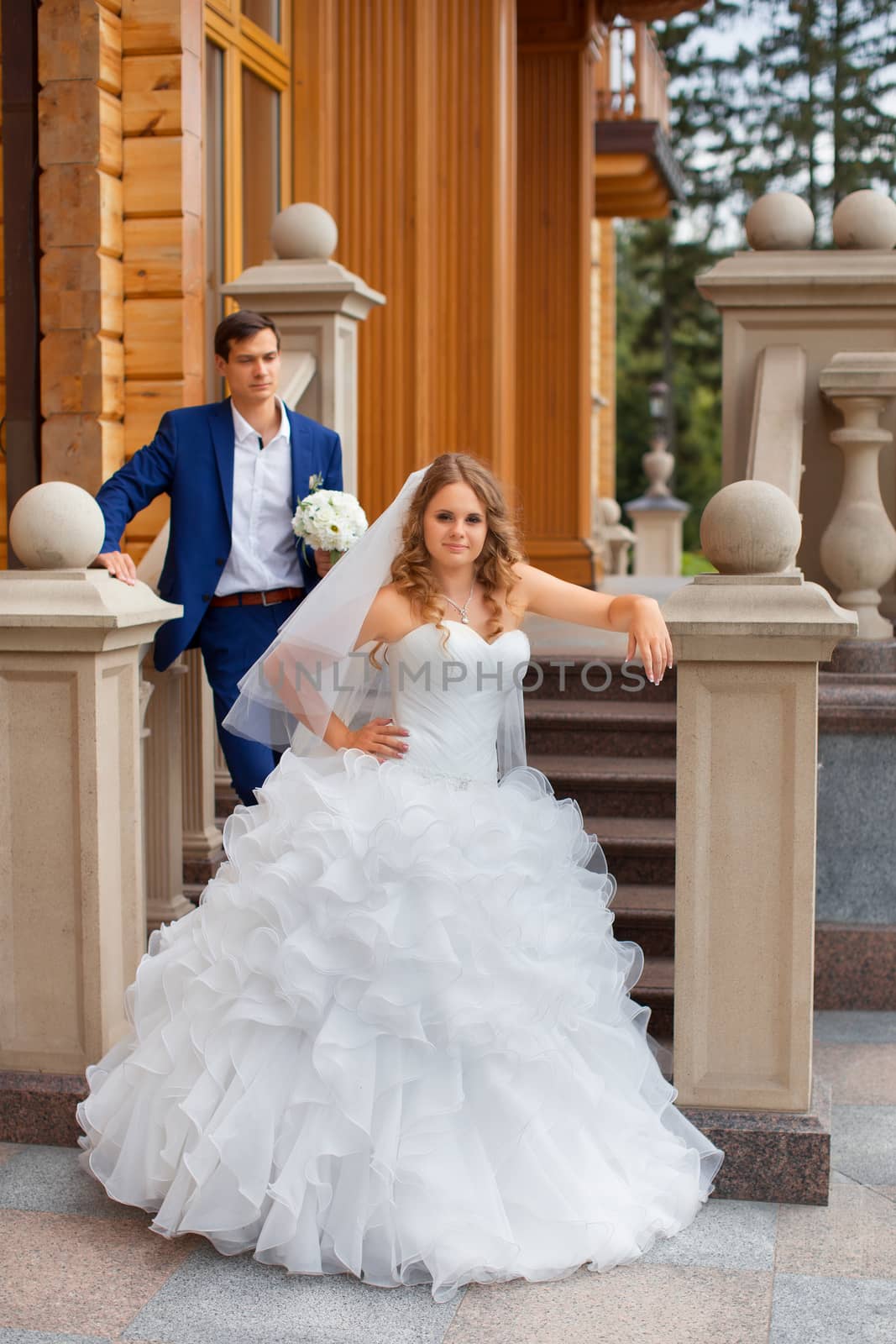 Newlyweds on a walk in the park on a warm sunny day