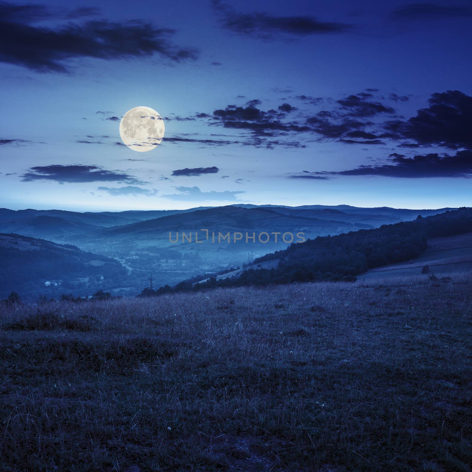 field in mountain near home at night by Pellinni