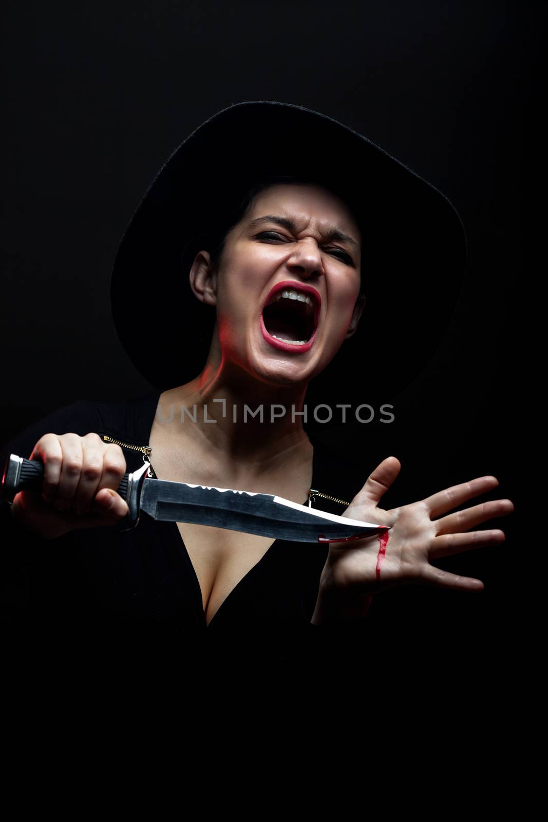 screaming girl with knife and blood on her hands