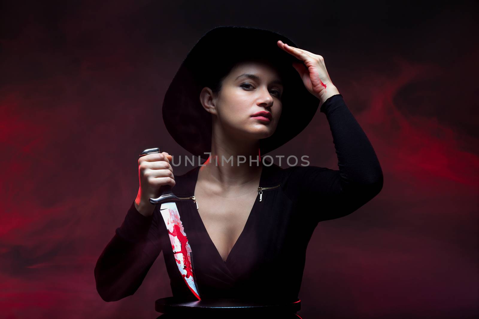 girl with a huge bloody knife, red smoke background