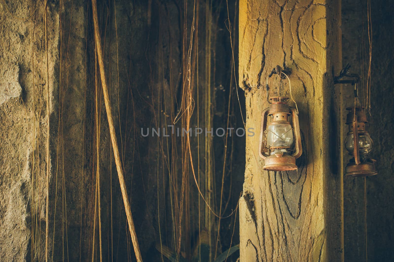 Kerosene lamp on wooden door background