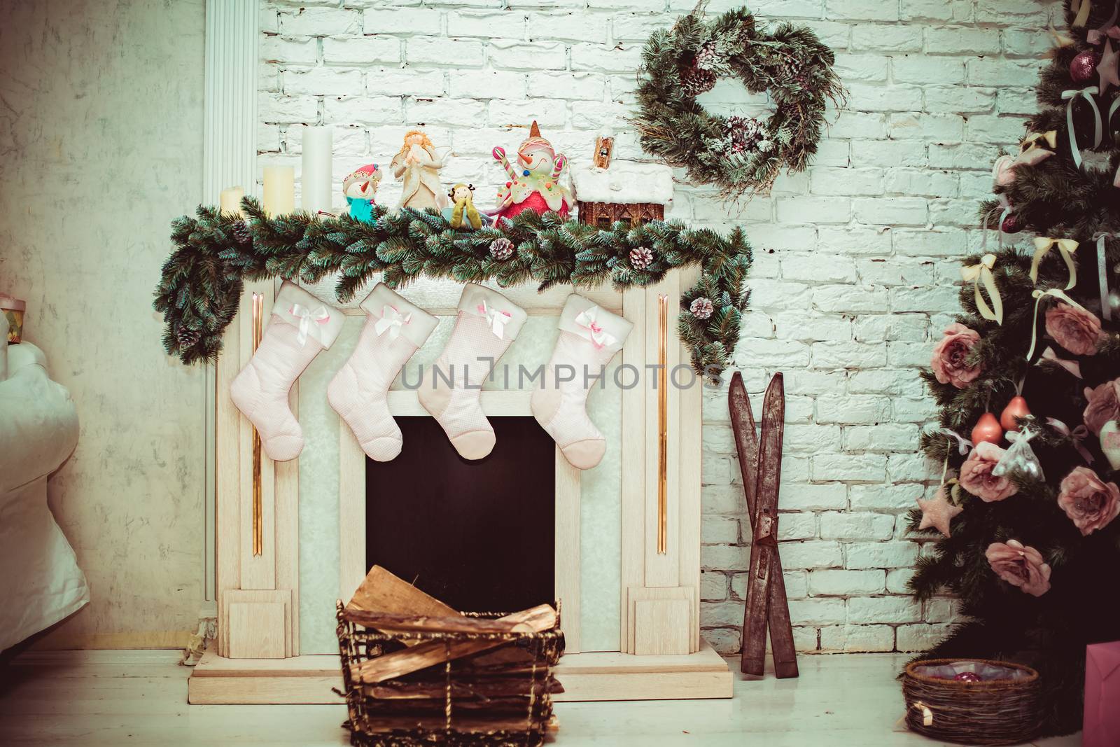 Beautiful holdiay decorated room with Christmas tree with presents under it