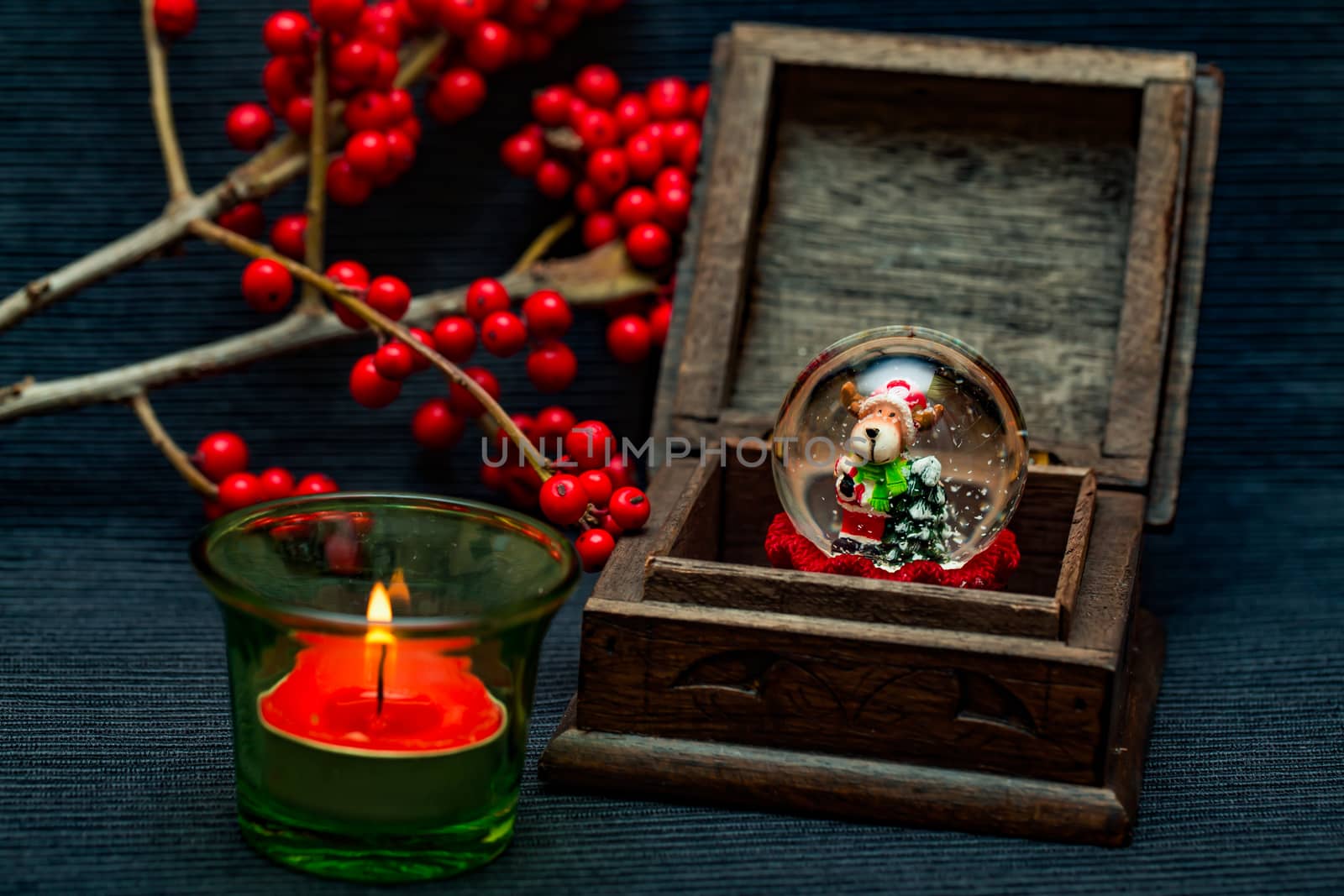 candle,ashberry and box on the black backgraund