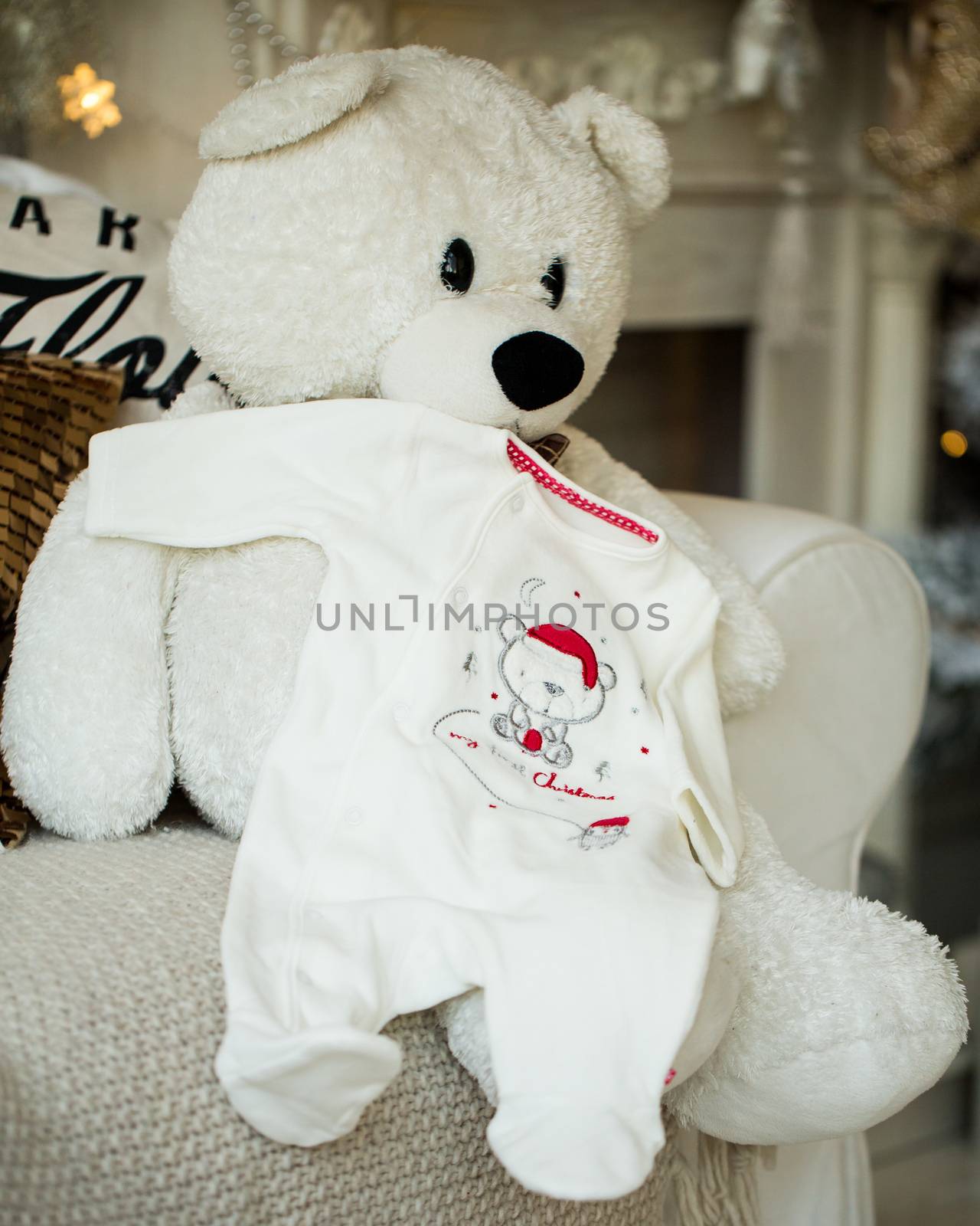 Bear Teddy on the armchair with baby sliders. by boys1983@mail.ru