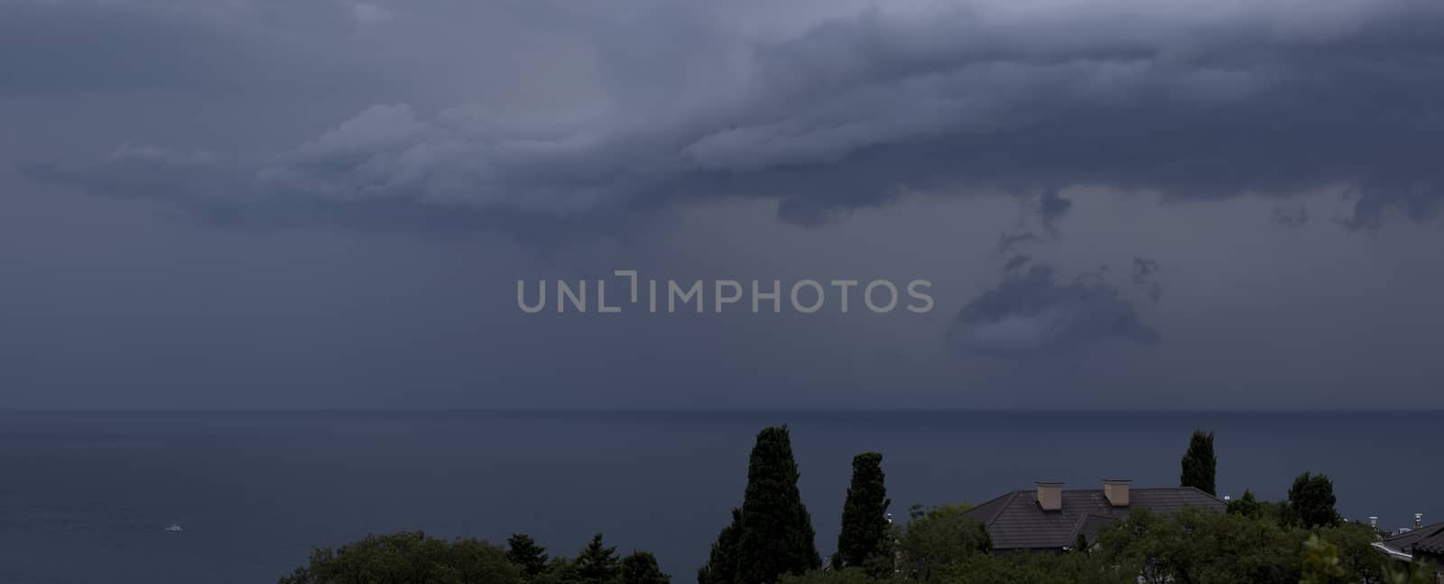 Panorama gray rain clouds over the Black Sea.