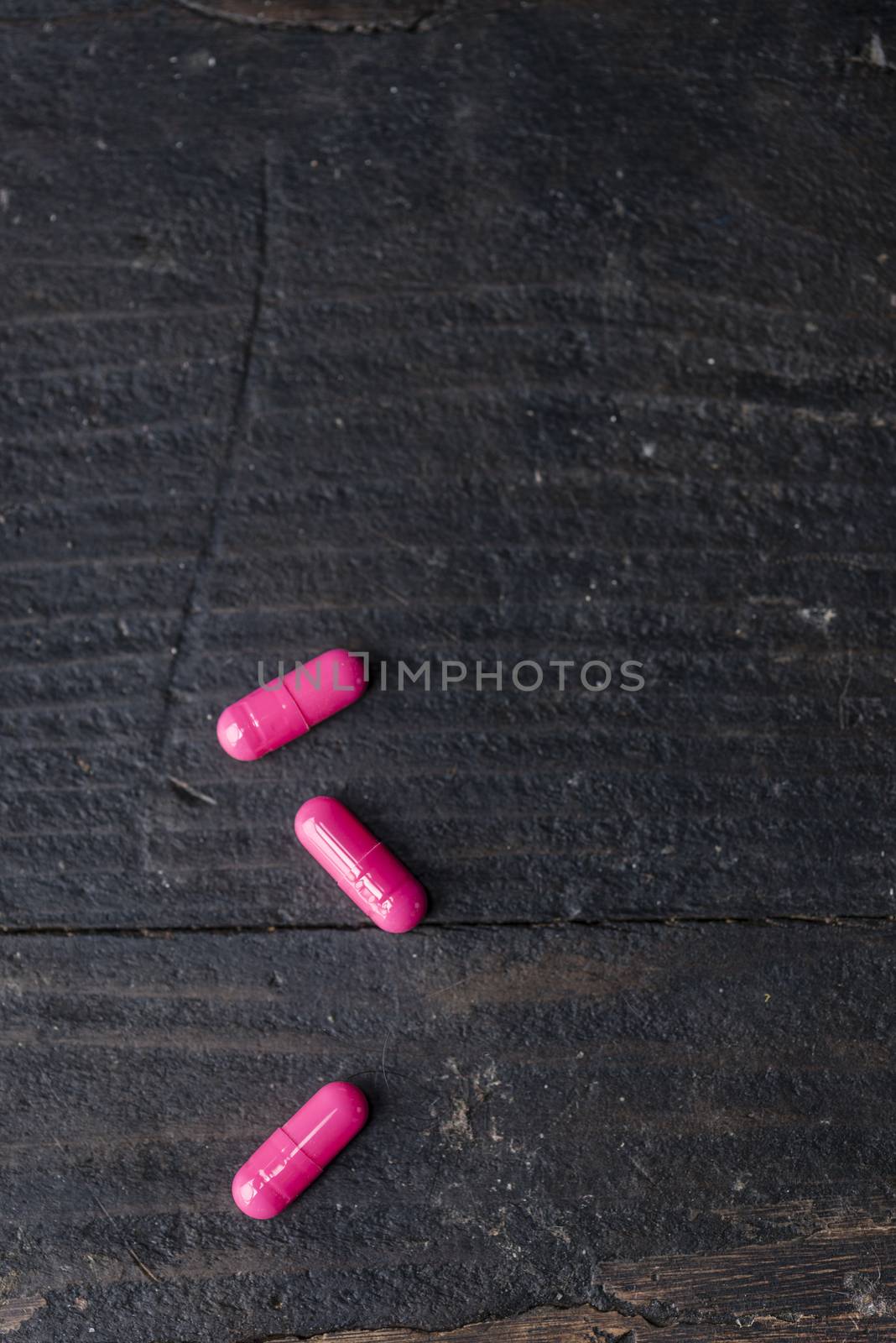 Pills and medicine over a dark table and backrgound.