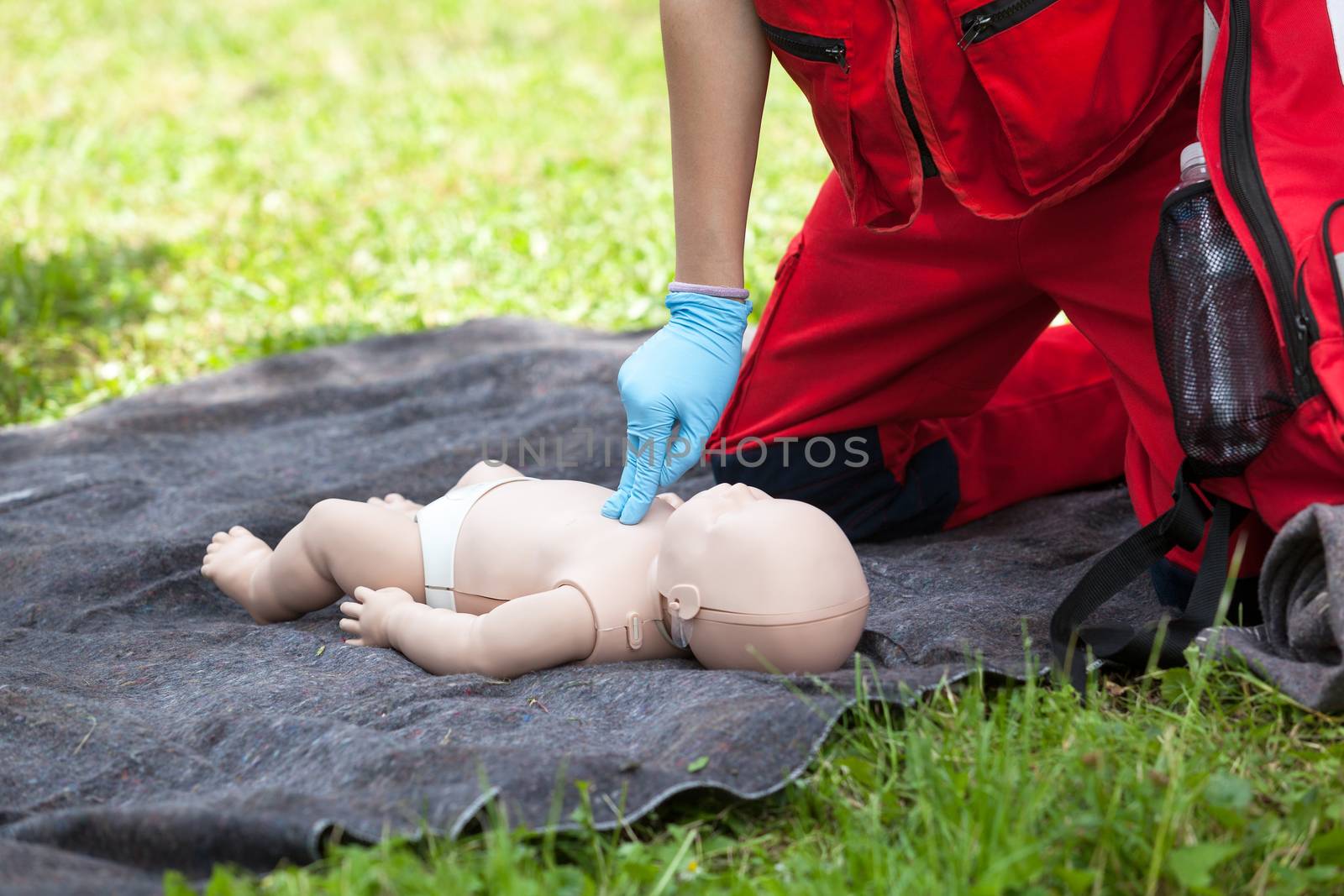 Baby CPR dummy first aid training. Cardiopulmonary resuscitation - CPR. Cardiac massage.