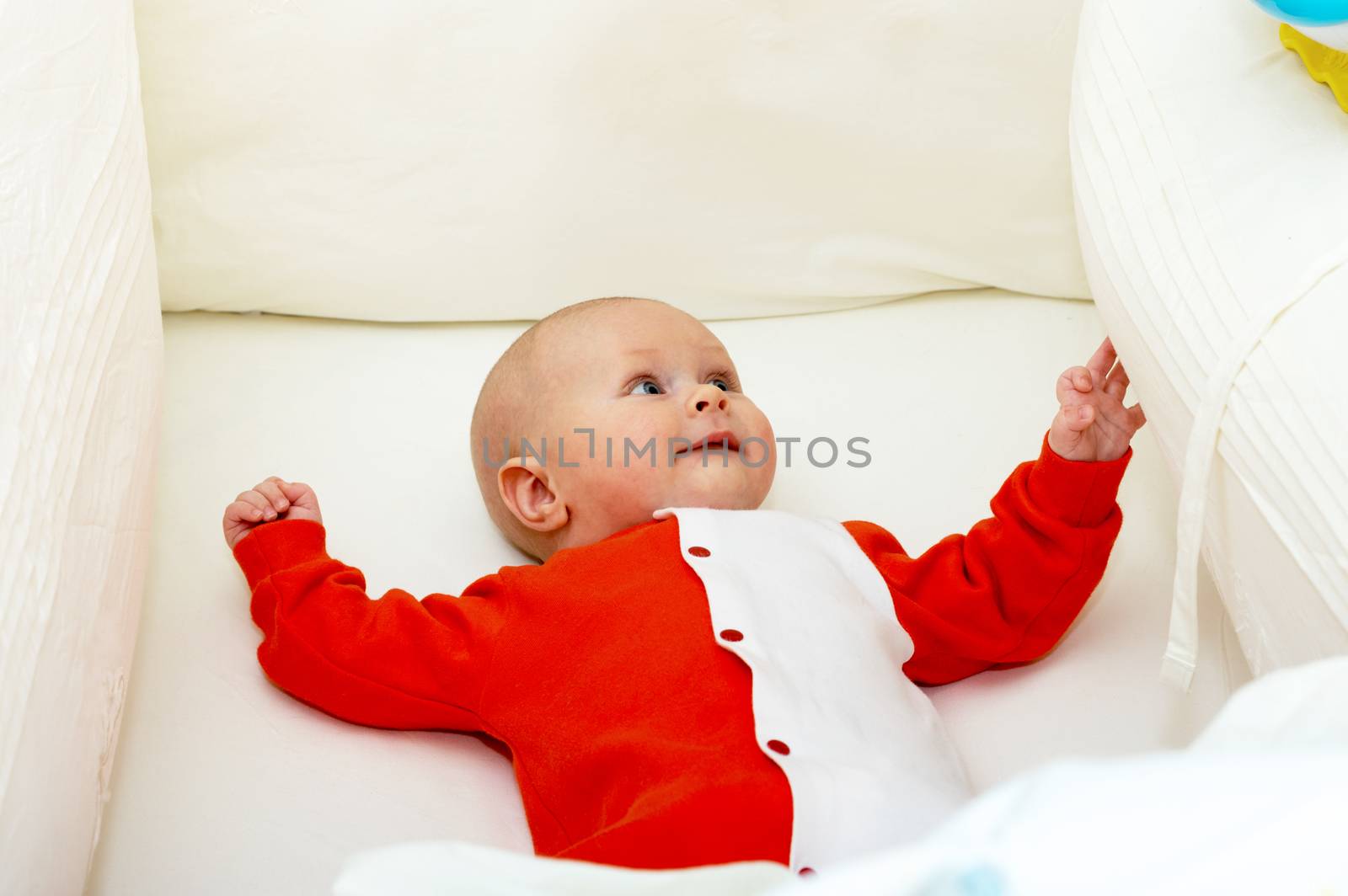 Close up shot of boy newborn in cot