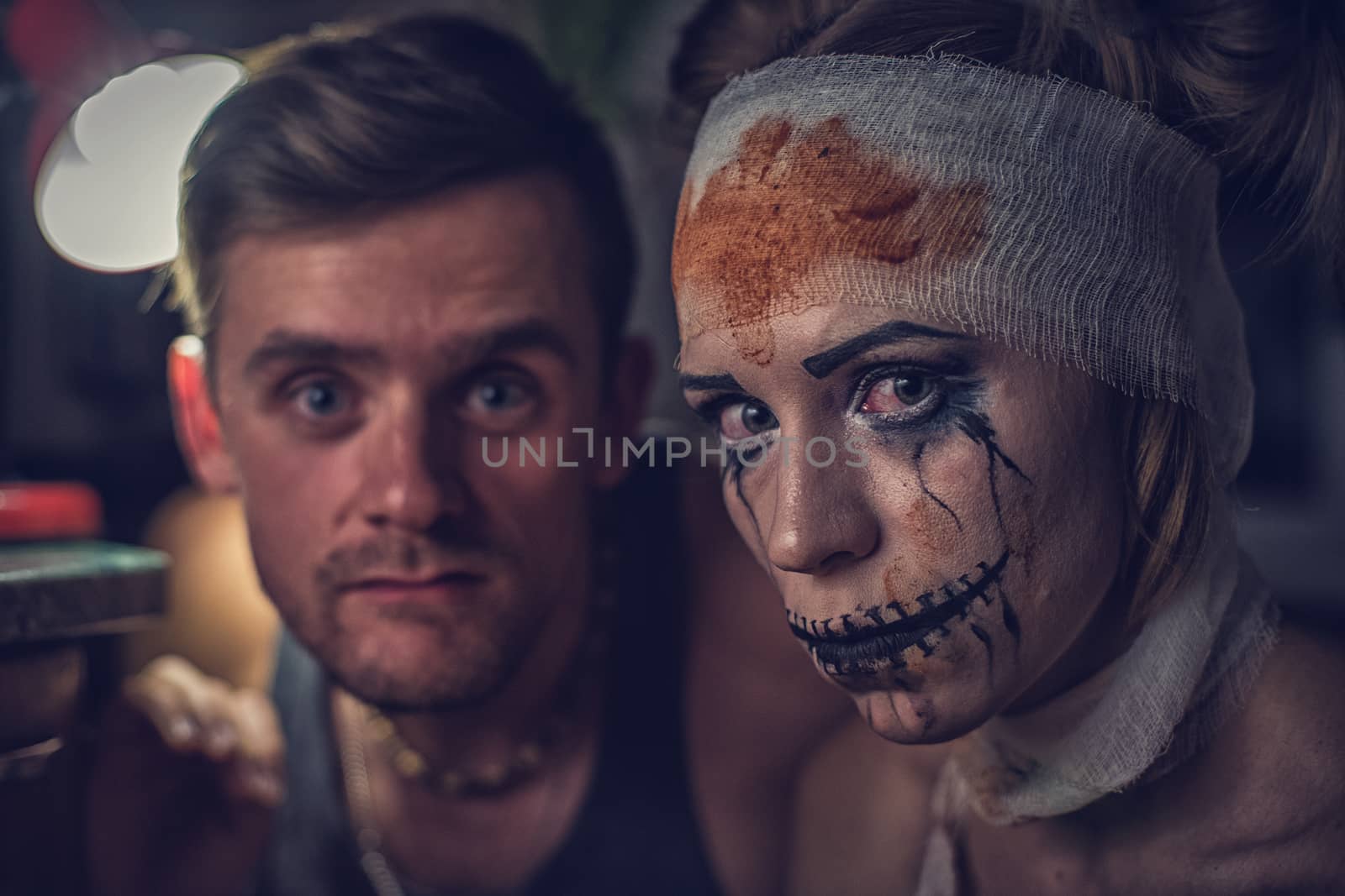 Horrible girl with her boyfriend, zombie halloween theme