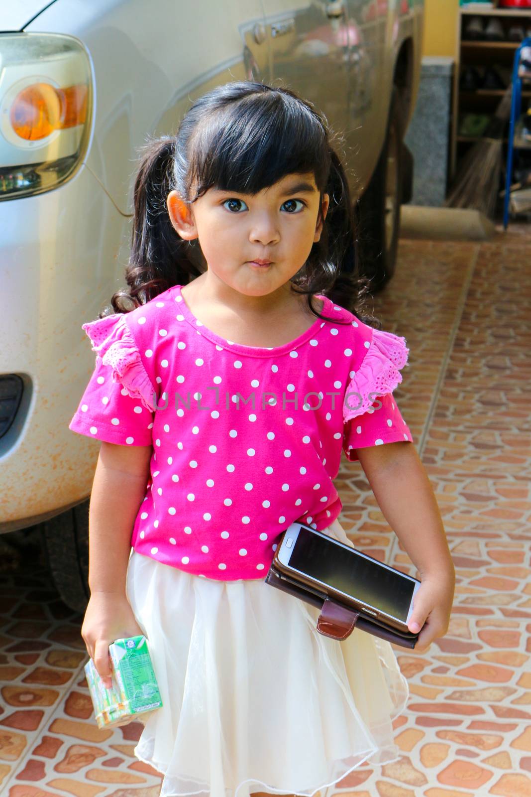 Pretty girl holding a telephone handset