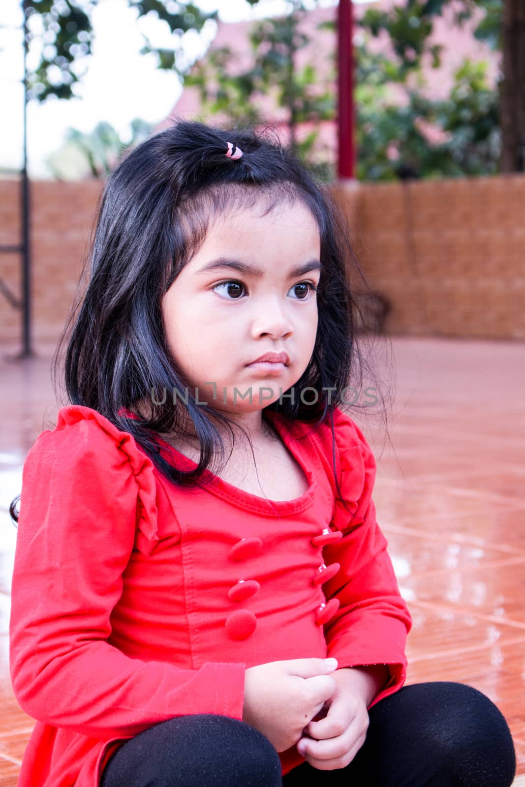 Pretty girl sitting alone