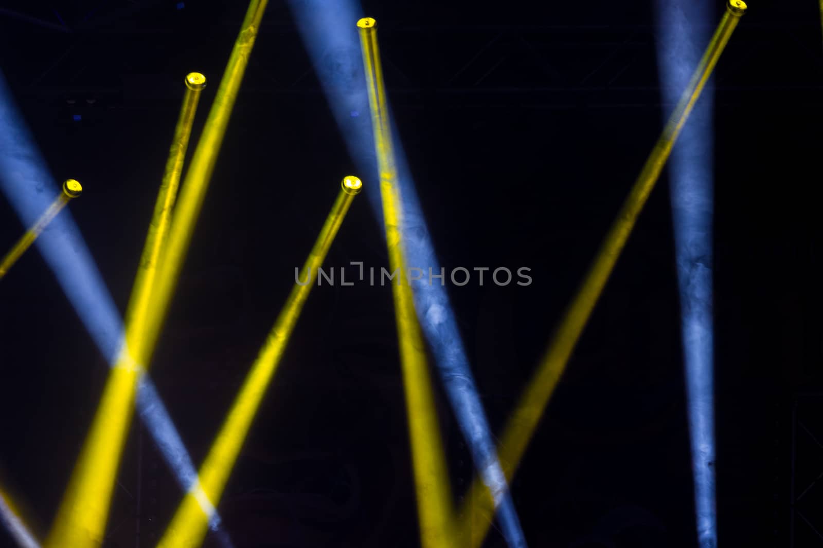 Colorful lights and smoke on a stage.