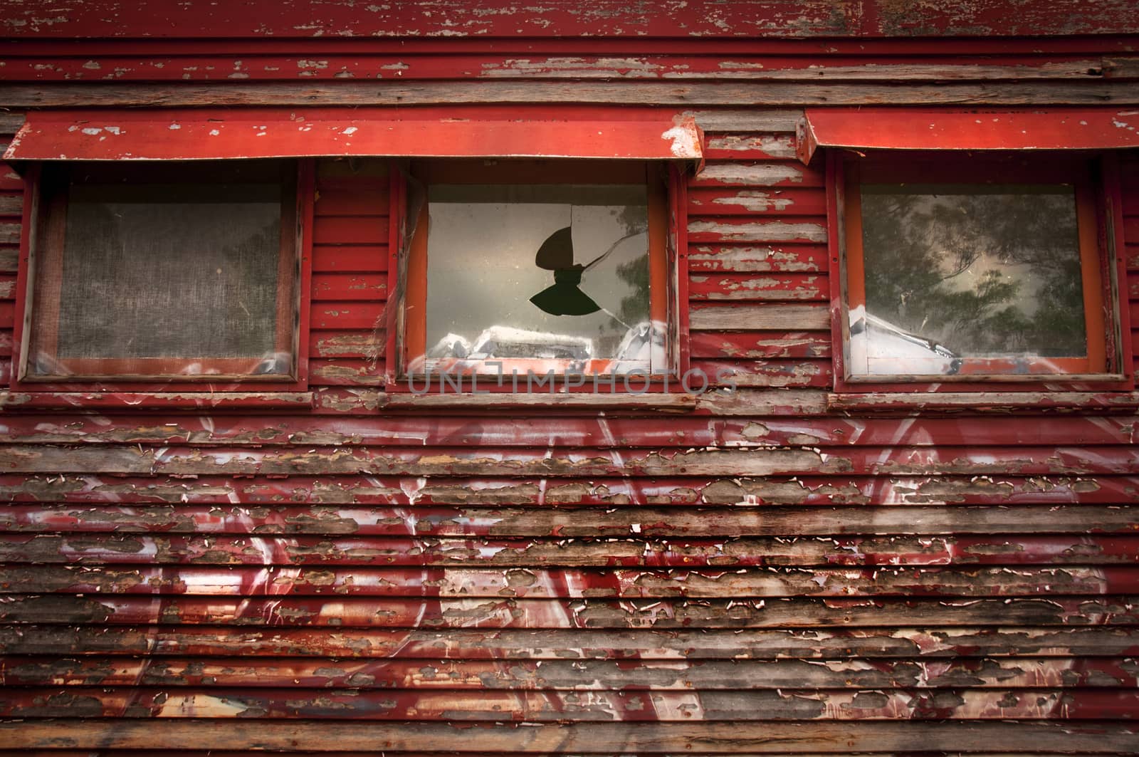 Abandoned train with broken windows
