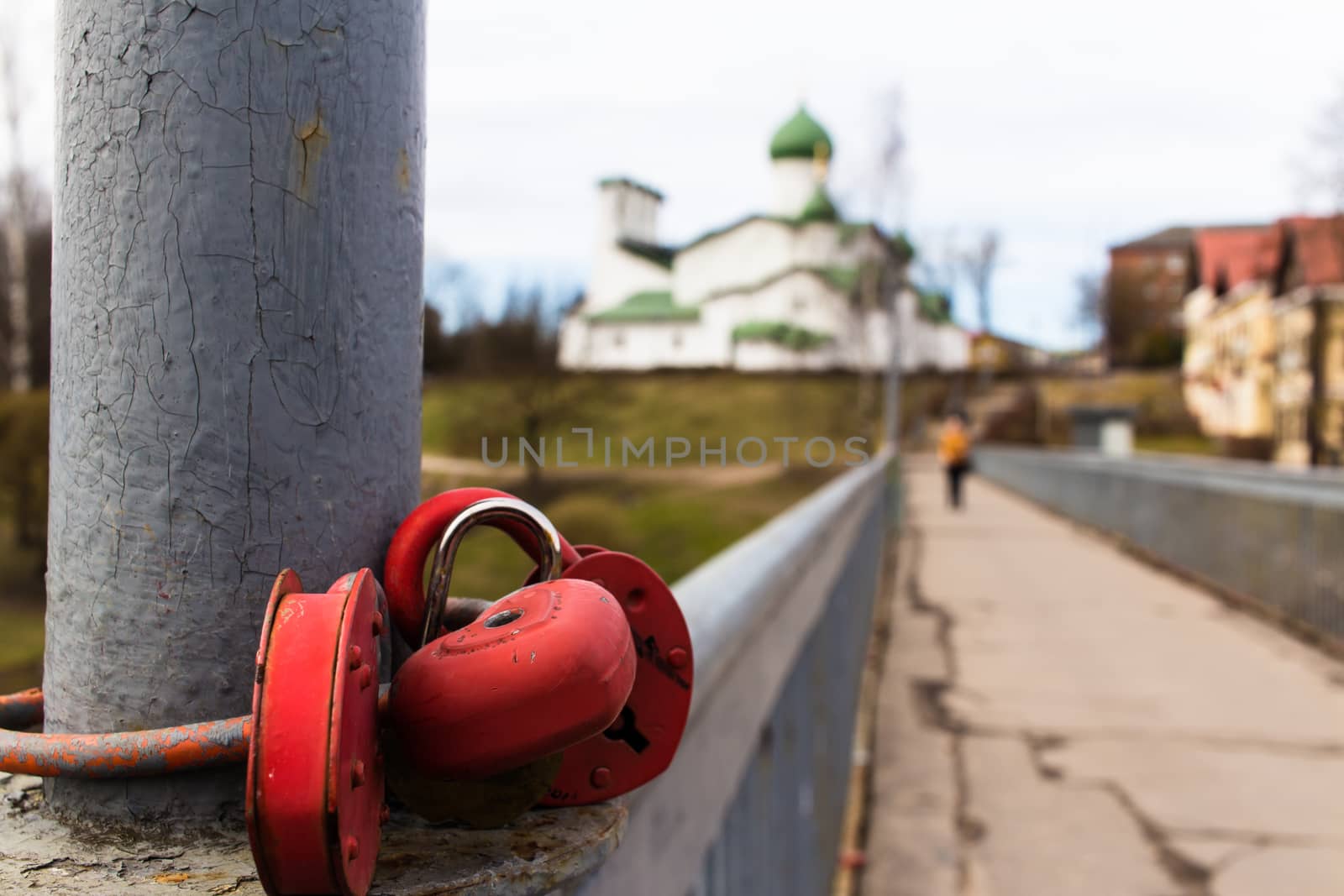 Group of red padlocks against the background of the orthodox church.