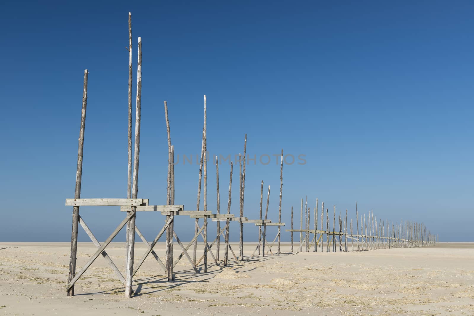 Pier on the sandbar the Vliehors on the island of Vlieland
 by Tofotografie