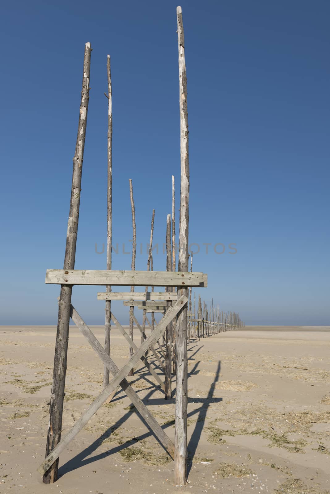 Pier on the sandbar the Vliehors on the island of Vlieland
 by Tofotografie