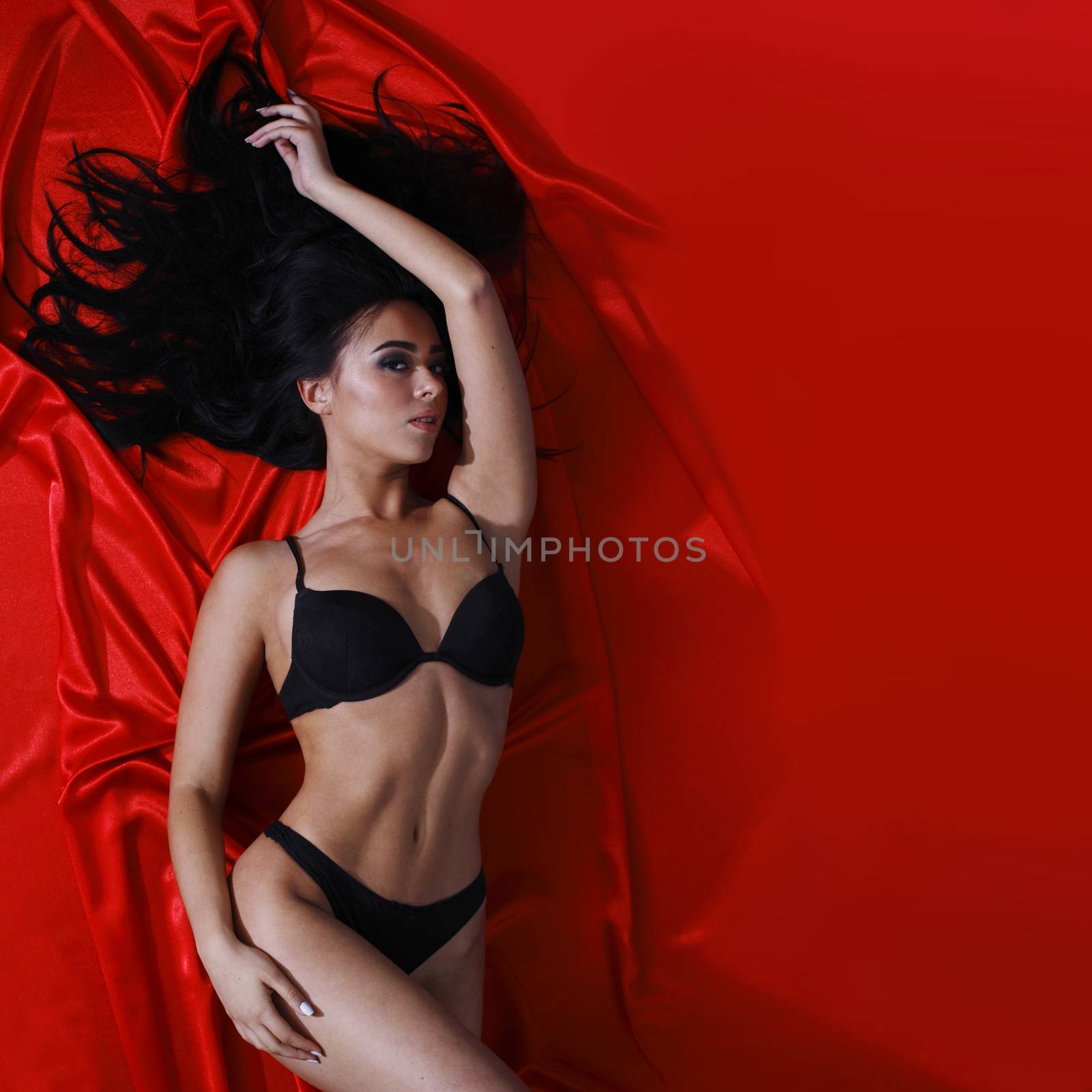 Woman on red silk by ALotOfPeople