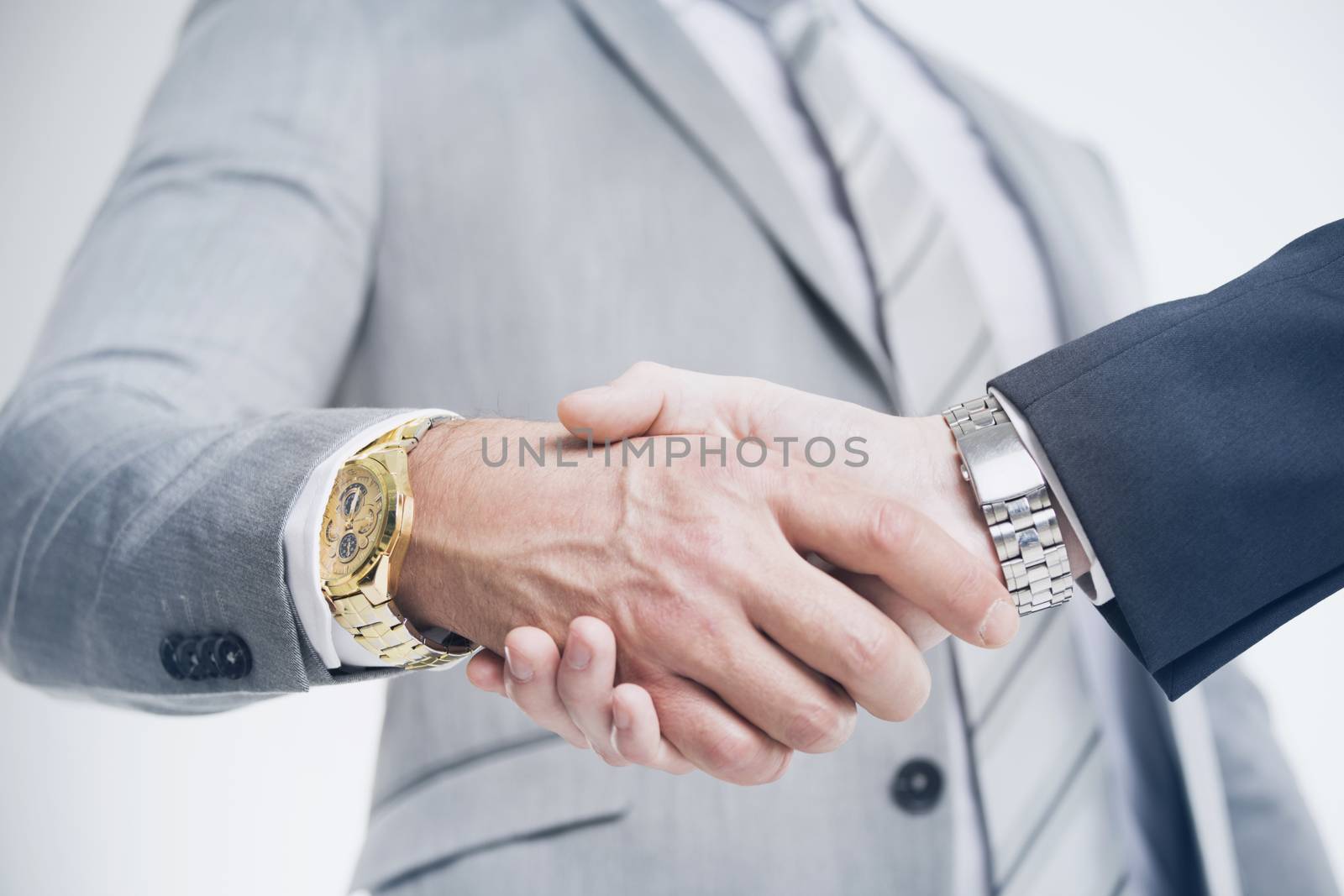 Closeup of a business hand shake by Yellowj
