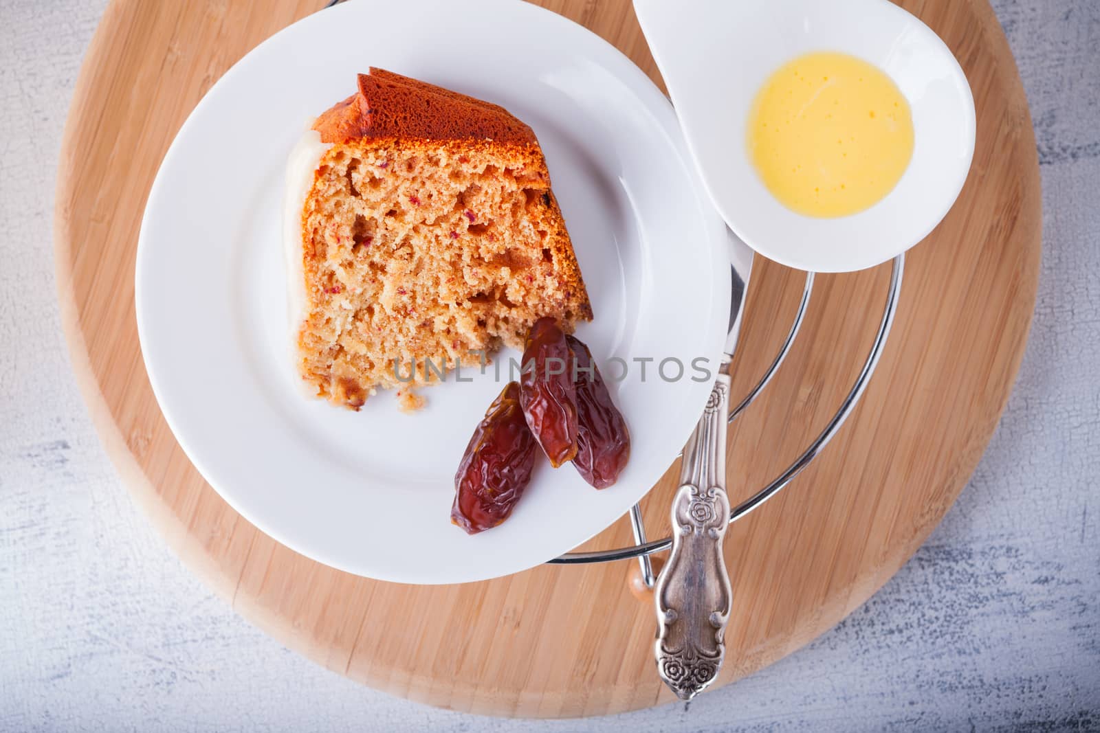 A slice of Date cake on a white napkin
