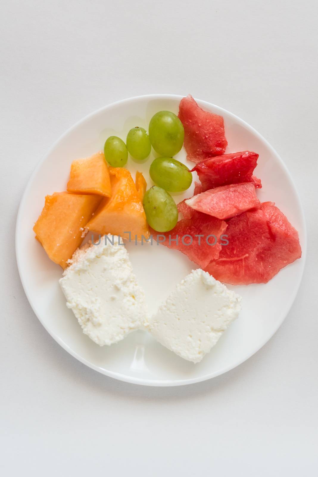 sliced watermelon, cantaloupe, cheese, grapes by okskukuruza