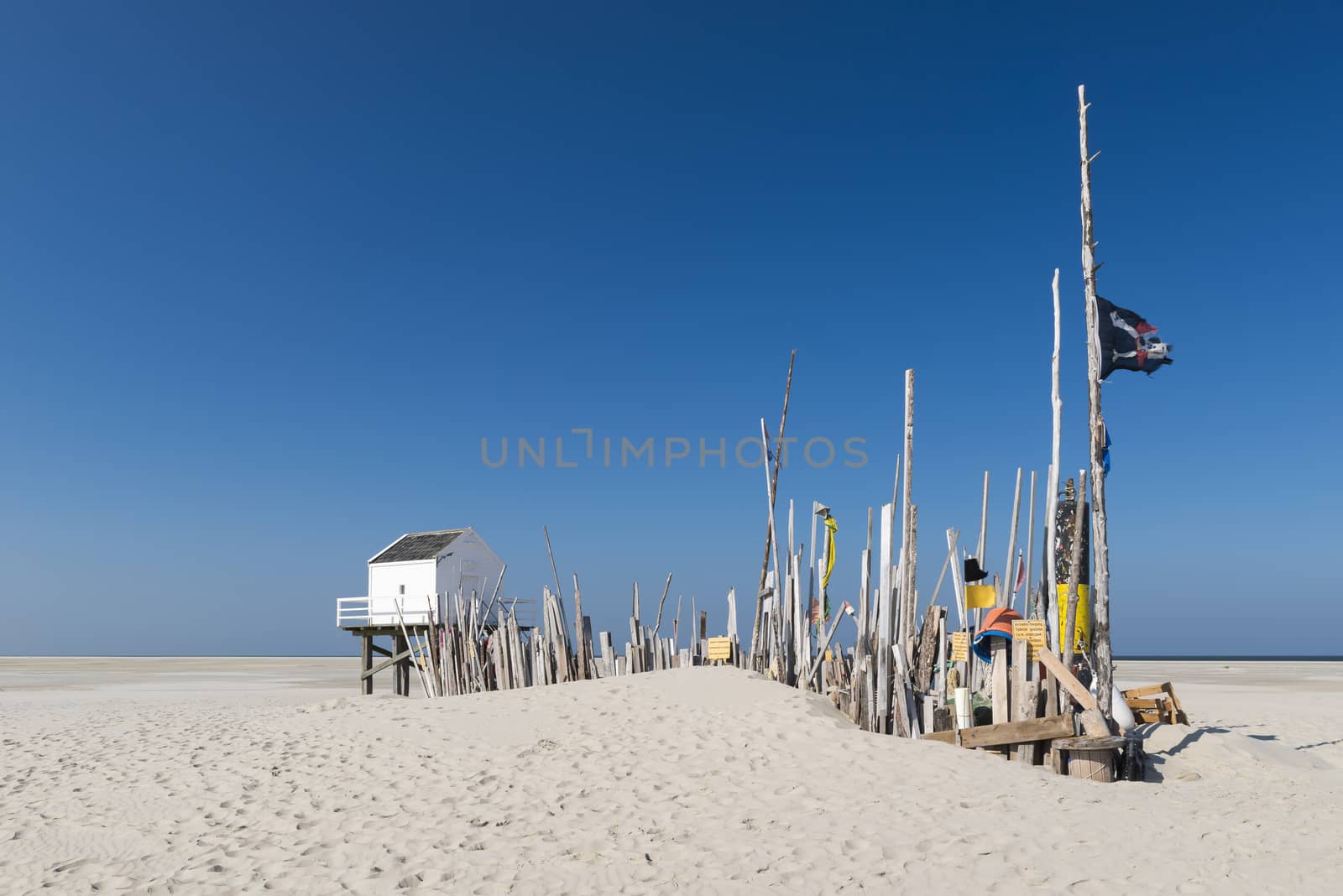 Famous sea cottage on the sandbar the Vliehors on the wadden Island Vlieland in the Netherlands
