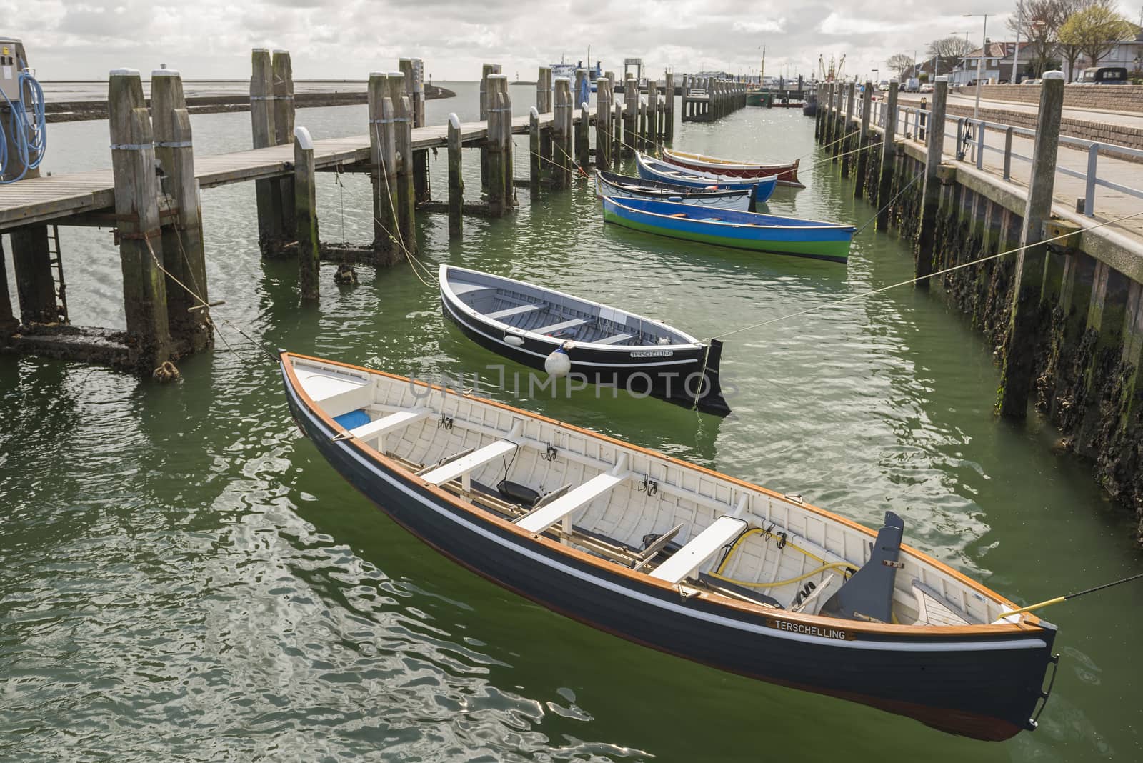 Rowing boats in the harbour of West Terschelling on the island of Terschelling in the North of the Netherlands
