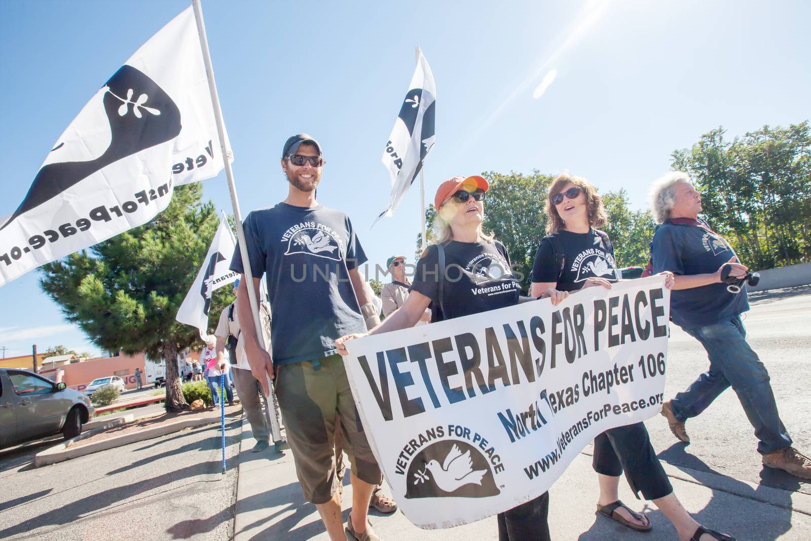 NOGALES, AZ - OCTOBER 08: Veterans for Peace group with flags and banners at protest march near the US and Mexico border on October 08, 2016 in Nogales, AZ, USA.