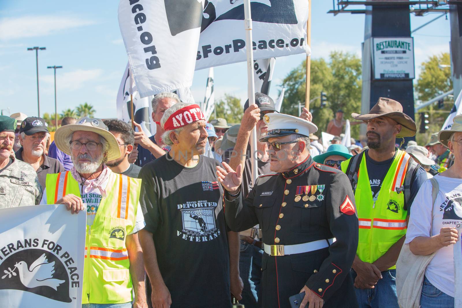 NOGALES, AZ - OCTOBER 08: Organizers with Veterans For Peace discussing logistics during border policy protest march on October 08, 2016 in Nogales, AZ, USA.