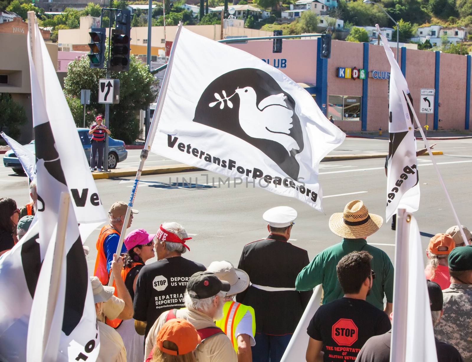 NOGALES, AZ - OCTOBER 08: Rear view of protestors marching toward the US and Mexico borders on October 08, 2016 in Nogales, AZ, USA.