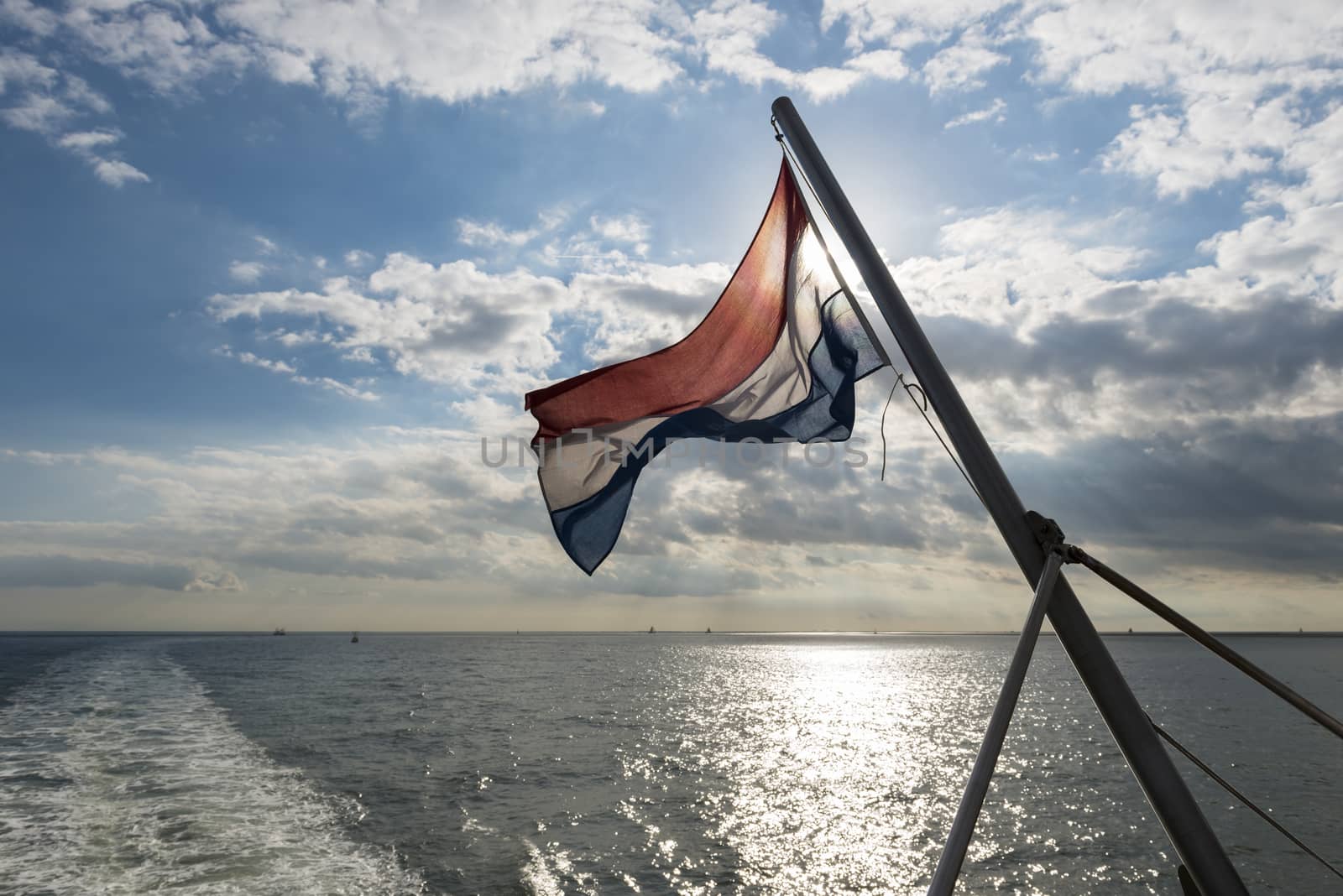 Wadden Sea with Dutch flag by Tofotografie