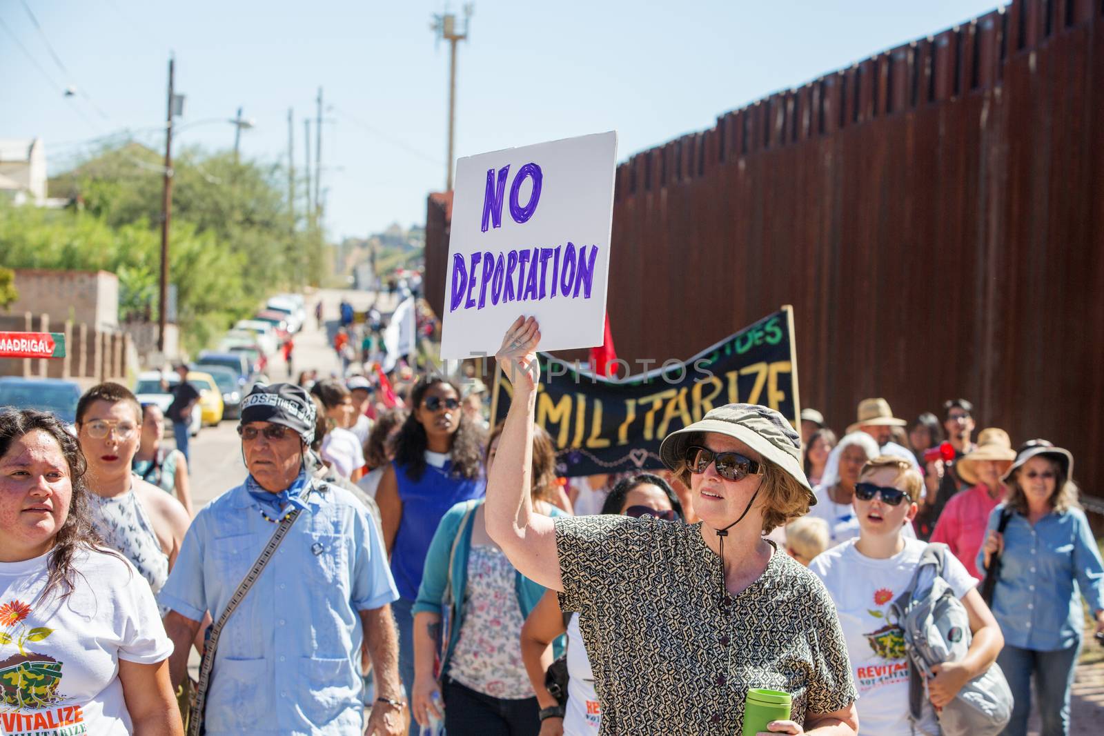 NOGALES, AZ - OCTOBER 08: Supporters and veterans protesting deportation policies at the United States and Mexico border on October 08, 2016 in Nogales, AZ, USA.