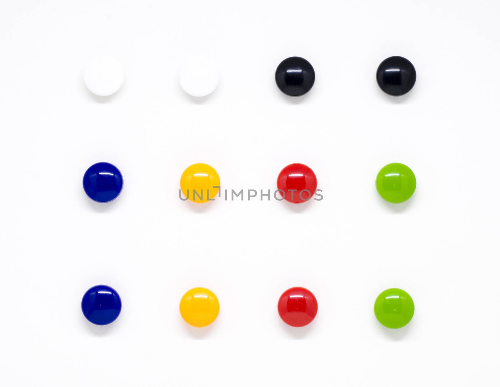 Colorful magnetic letters on white background by phochi