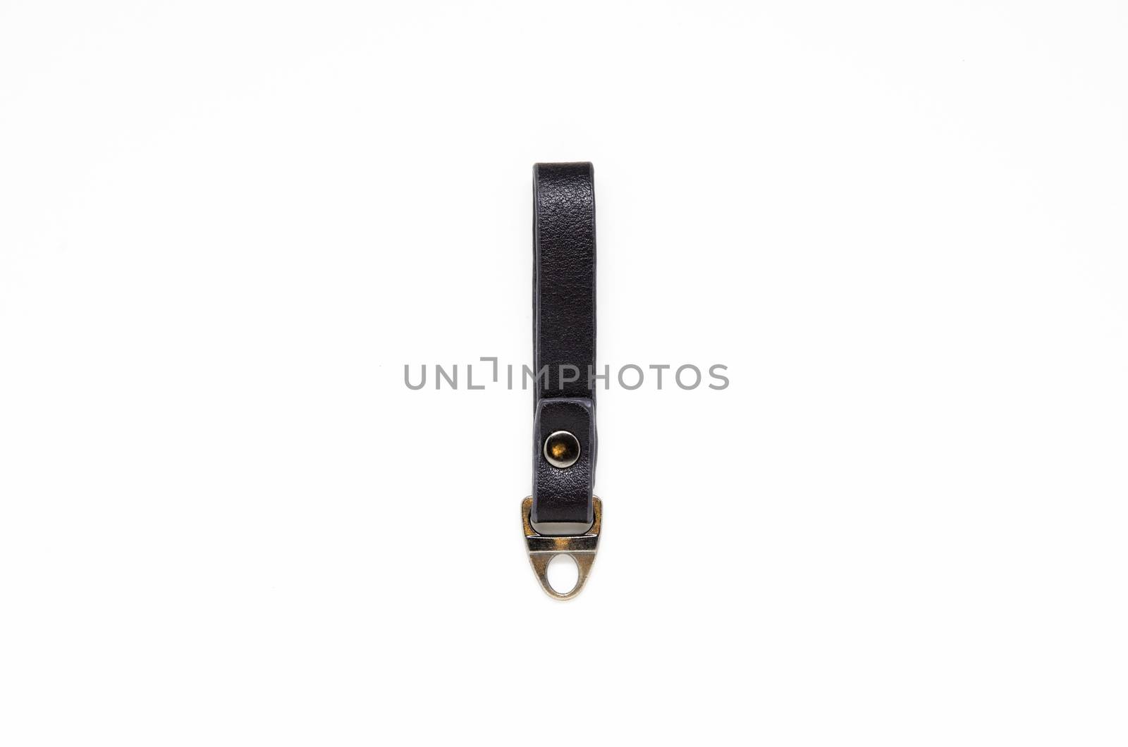 Leather keychain on white background by phochi