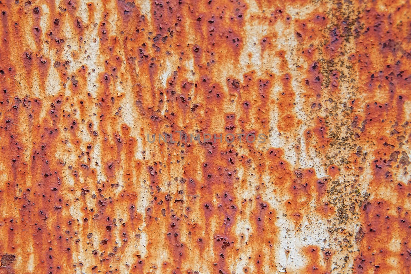 Rusty metal wall background with streaks of rust. by natazhekova