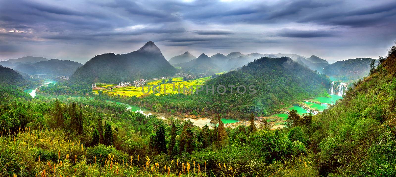 Panorama of Jiulong waterfall at sunset in Luoping, China.