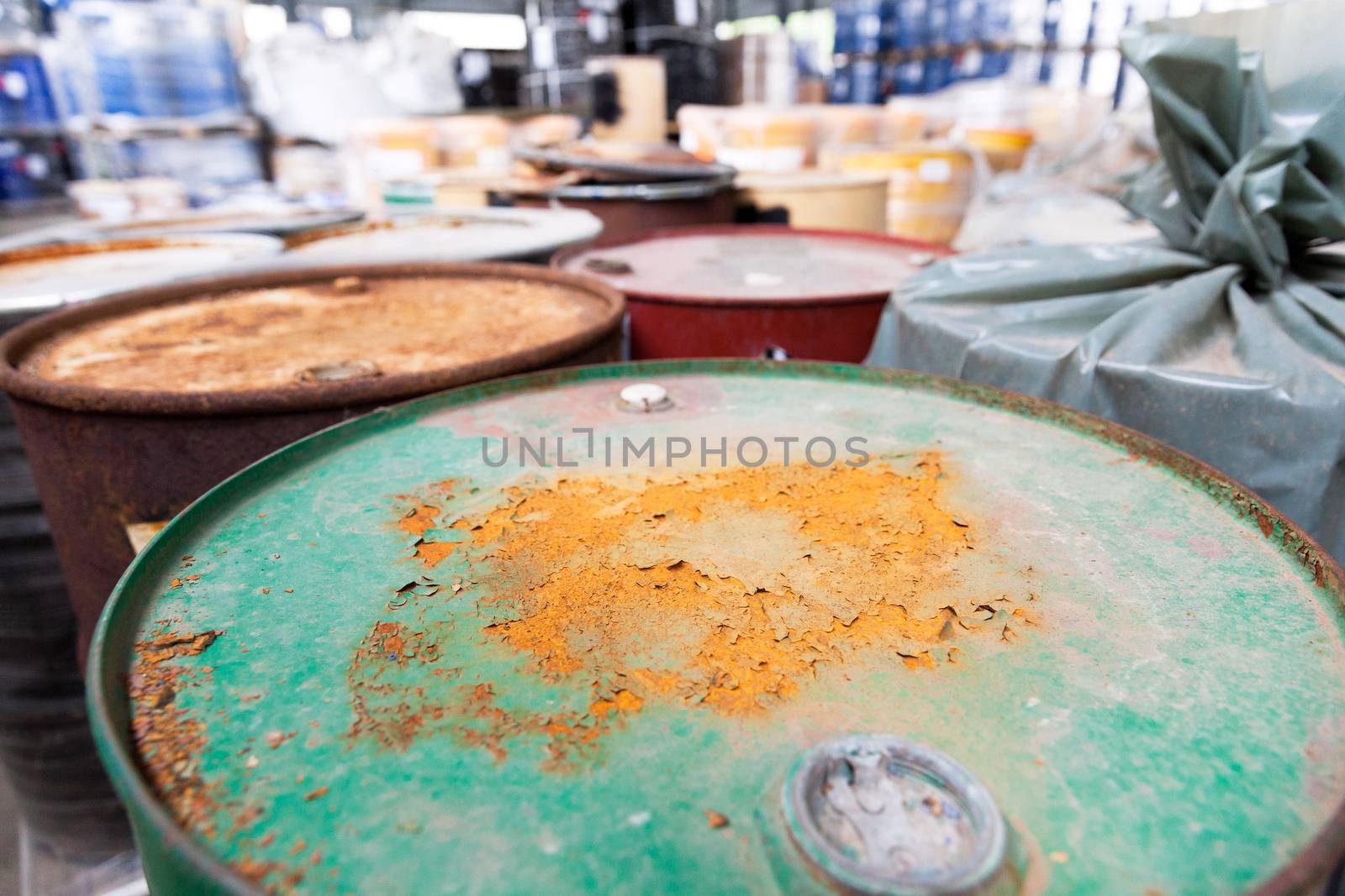 Rusty barrels with toxic chemical waste by wellphoto