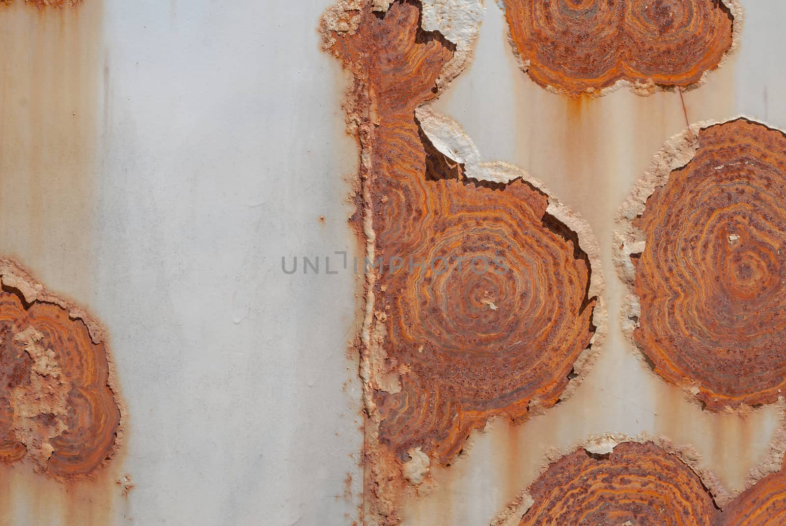 surface of rusty iron with remnants of old paint, grunge metal surface, texture background by uvisni