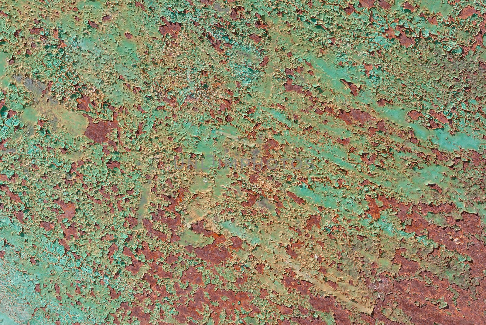 surface of rusty iron with remnants of old paint, grunge metal surface, texture background by uvisni