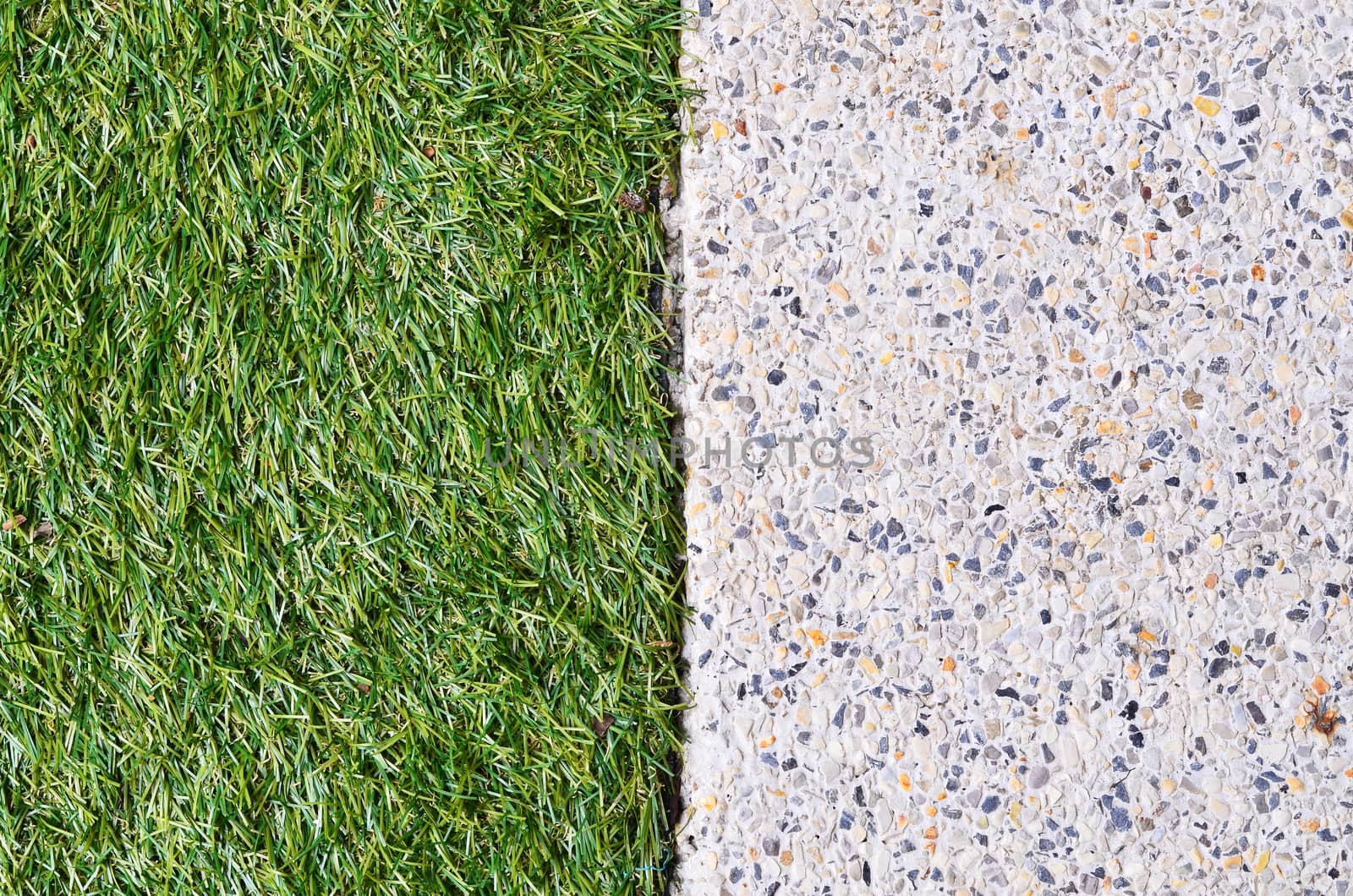 Gravel texture and strip grass as background copy space
