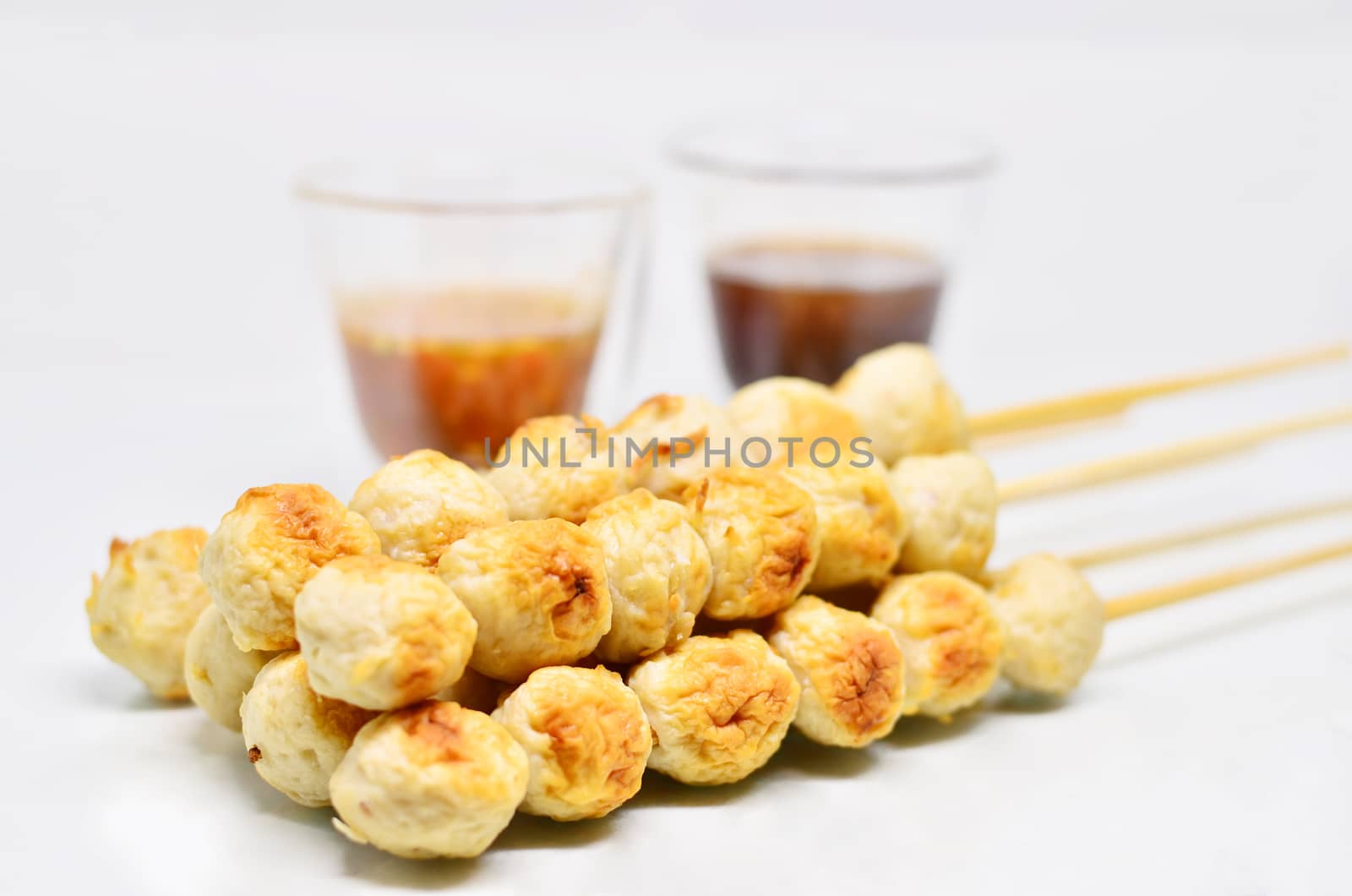 Meatball with thai spicy sauce isolated on white background
