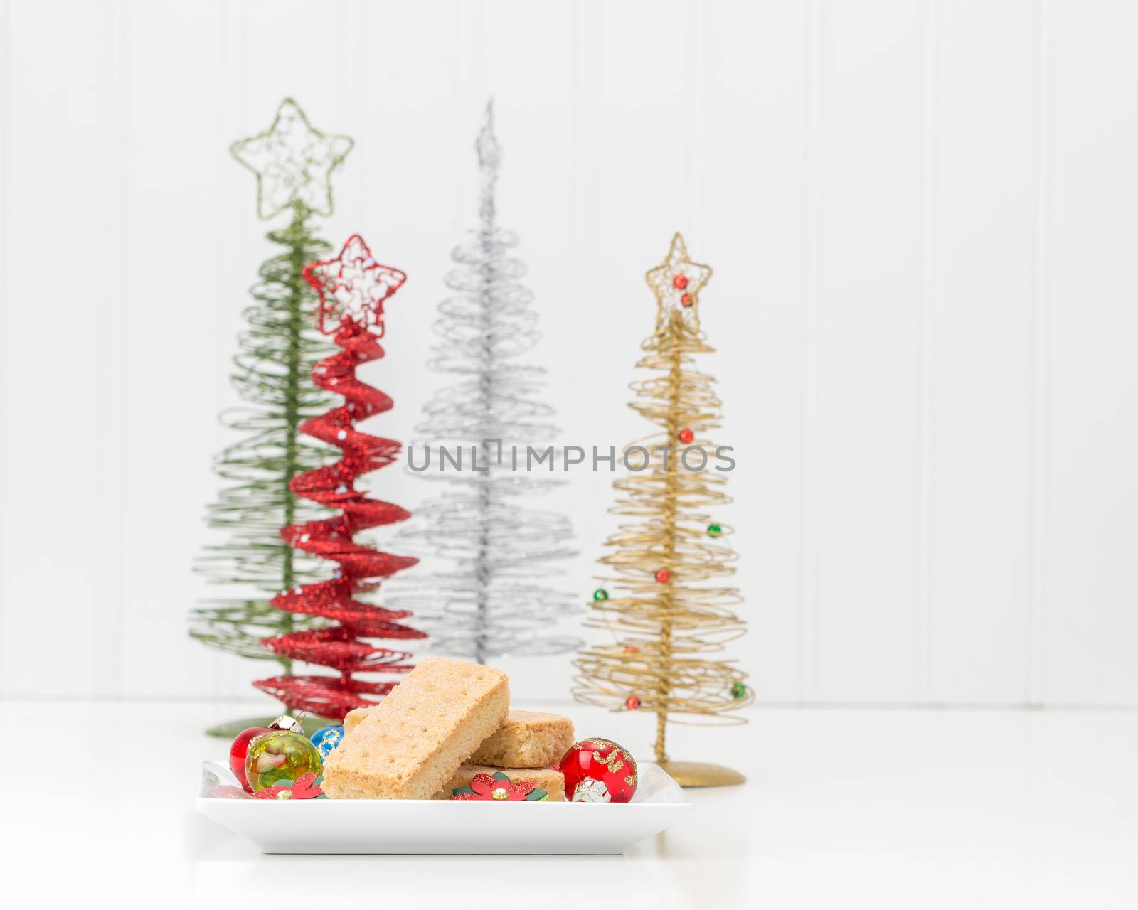 Plate of traditional festive shortbread cookies in a christmas setting.