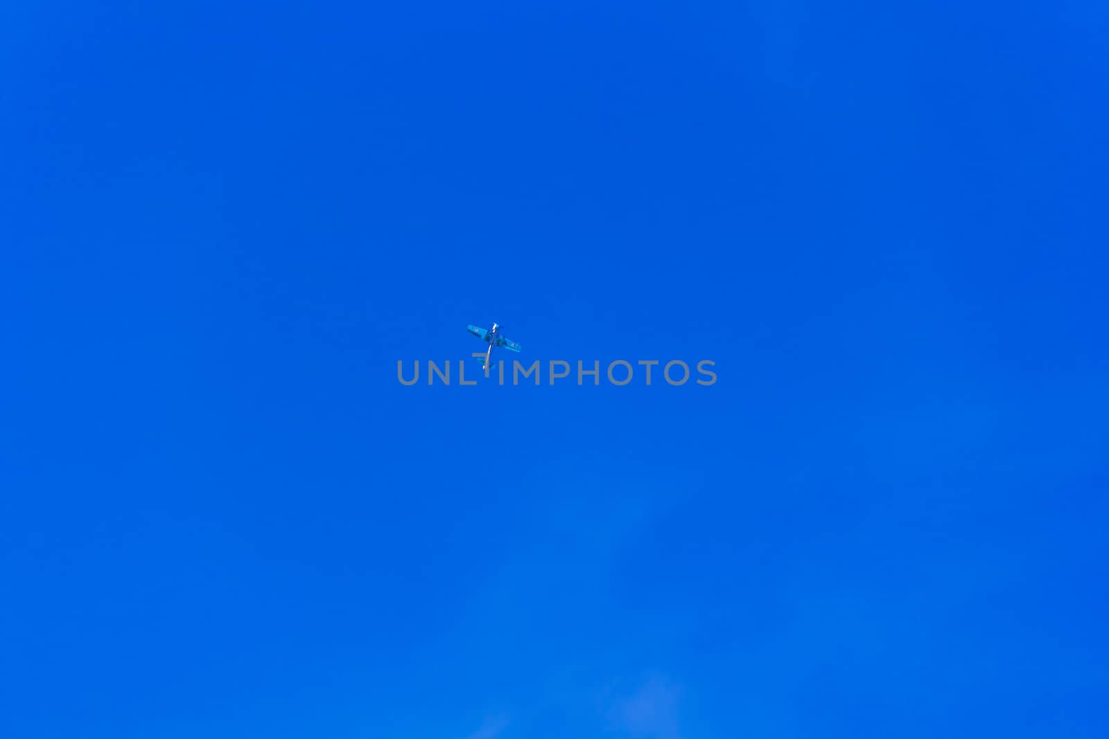 Photo of flying military airplane in blue sky