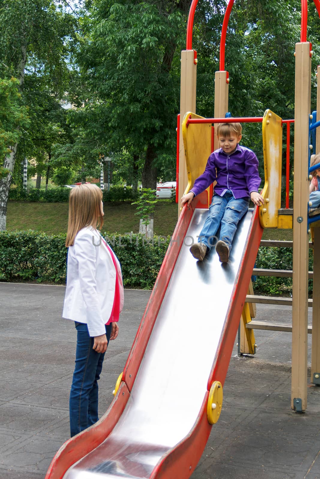 Mother and son riding on hutches at the playground