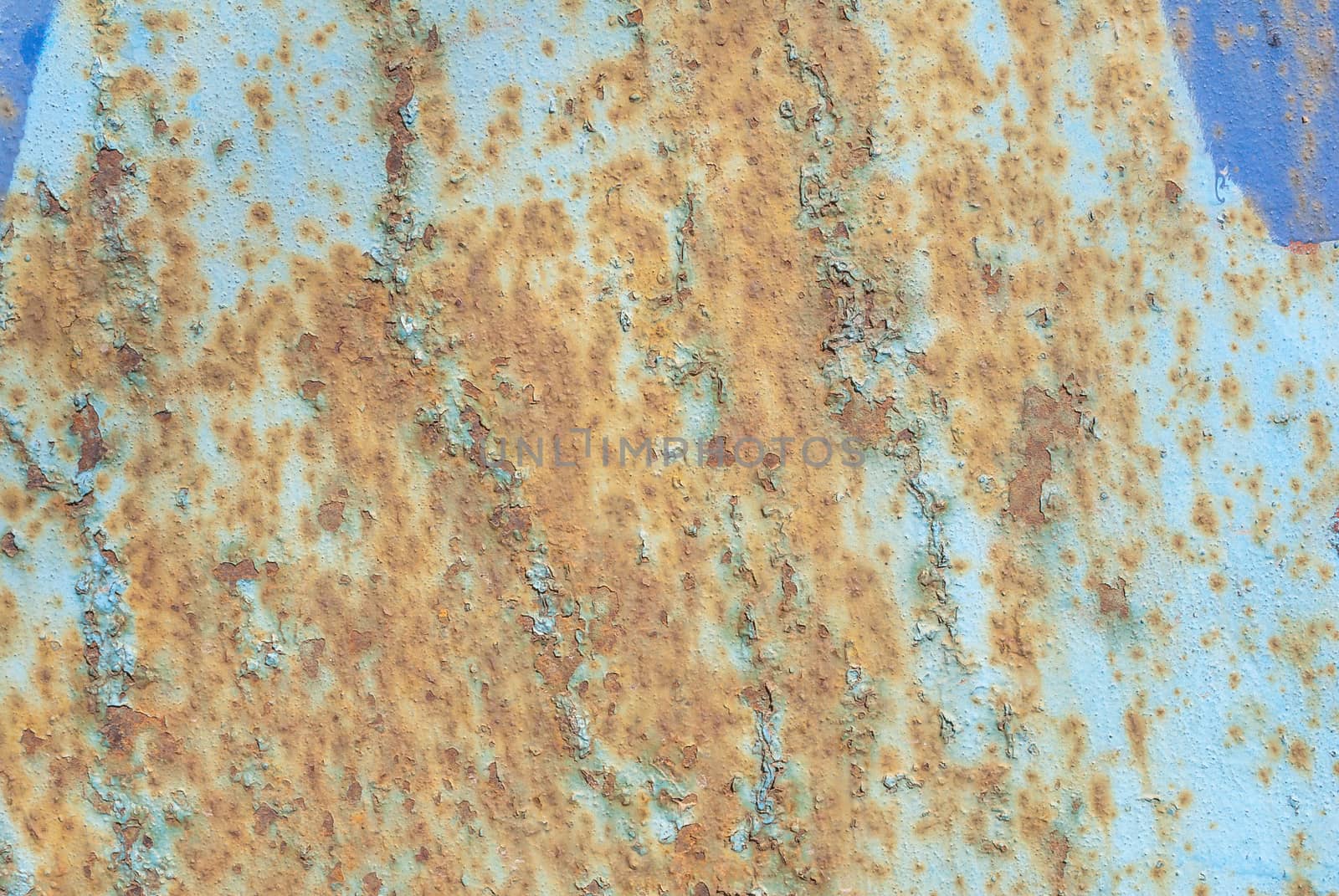 surface of rusty iron with remnants of old paint, grunge metal surface, texture background by uvisni